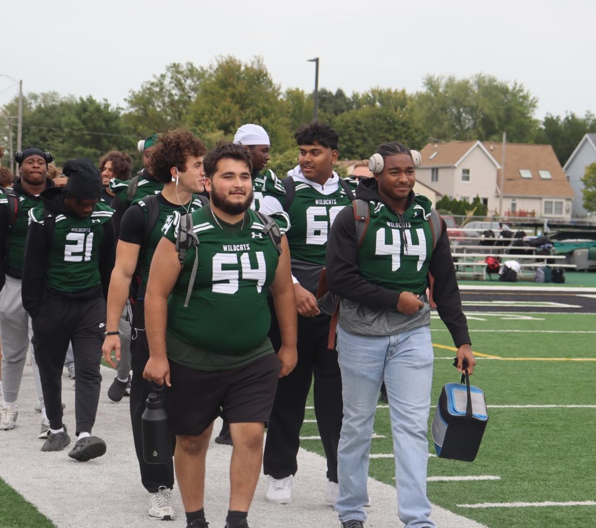 Football Team being led onto the field by Tyler Ibarra.