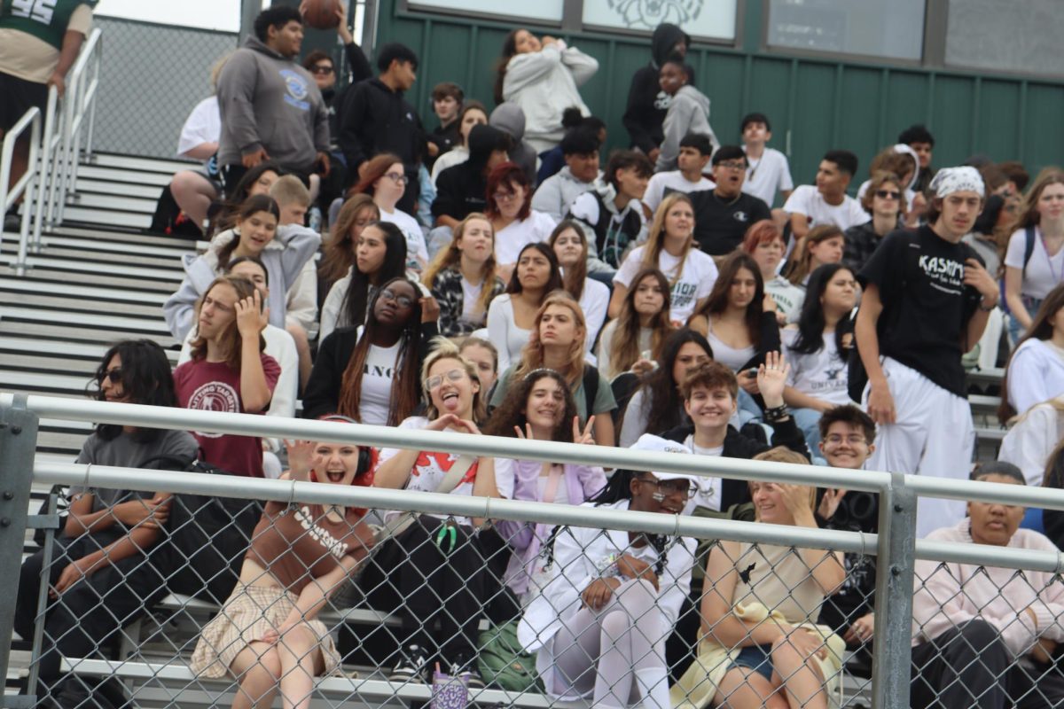 Students hanging out in the bleachers during the Pep rally.