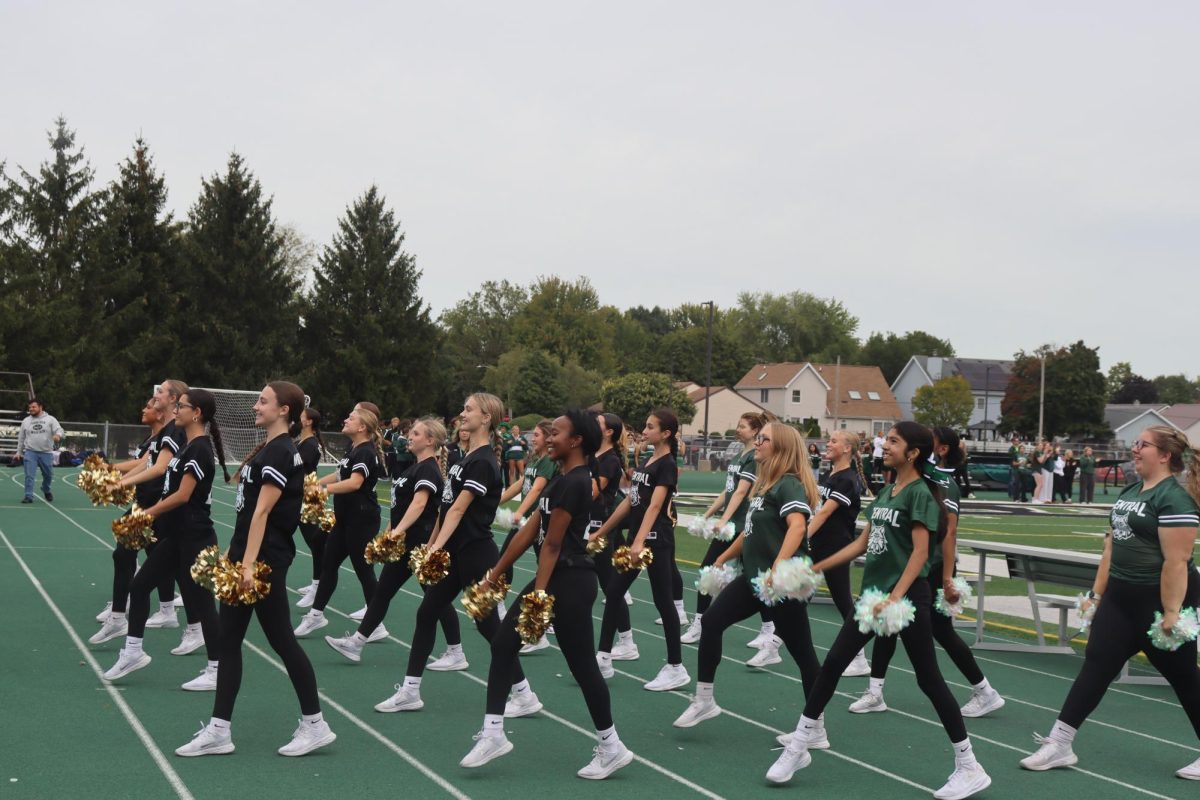 The Poms team pumps up the crowd during the Pep rally.