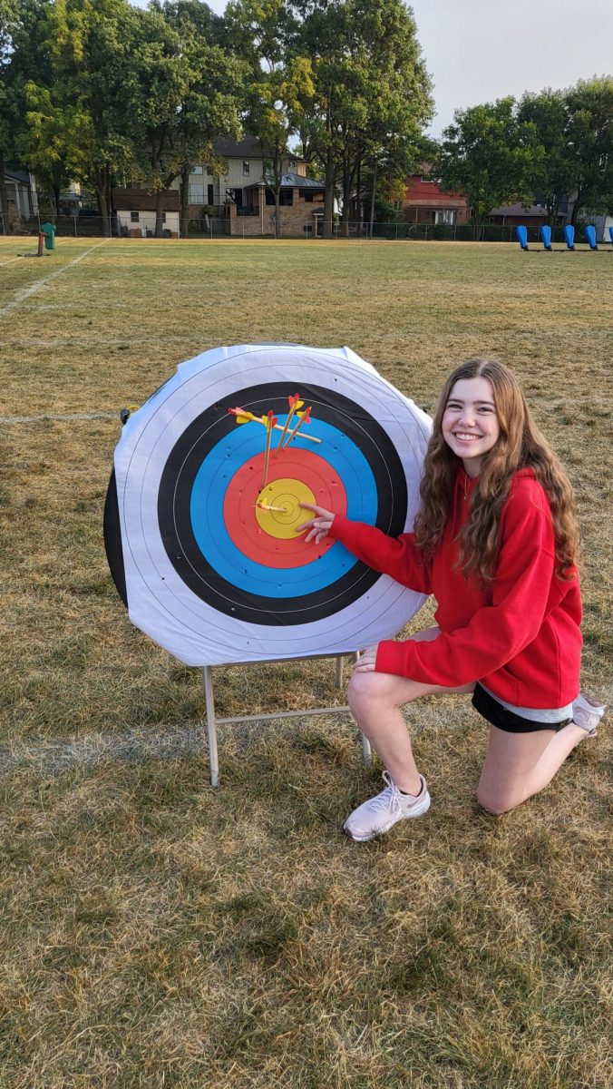 Olivia Ruba, junior, shows off the accuracy of her arrows in Adventure Challenge class.