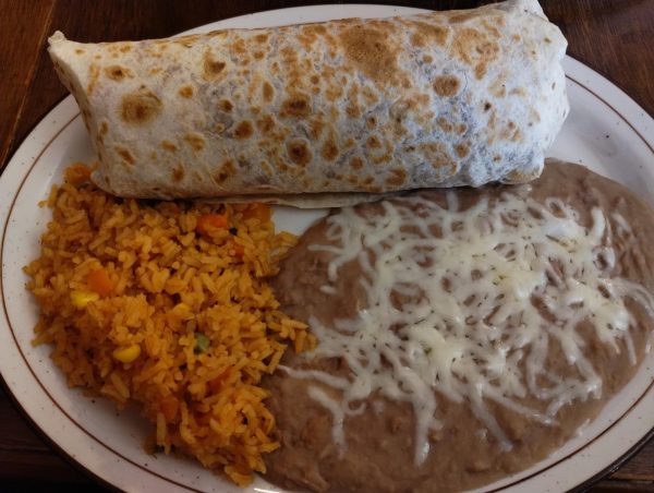 The Monterey Burrito that is filled with steak, cheese, lettuce, beans, sour cream, and tomatoes with a side of rice and beans.