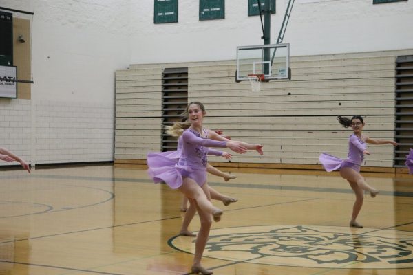 Evelyn Minott, senior, and Camila De La Torre, junior, dances for faculty in main gym on Jan. 22