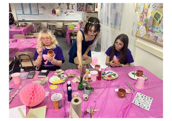 Annabelle Seum, alum, Mikaela Velazquez, junior, and Camilla Herrera, senior paint pots as part of last year’s BeYOuty activity.