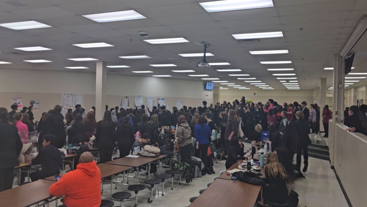 Speech teams from different schools congregate in the Waubonsie Valley High School cafeteria to see who advanced to the final round.